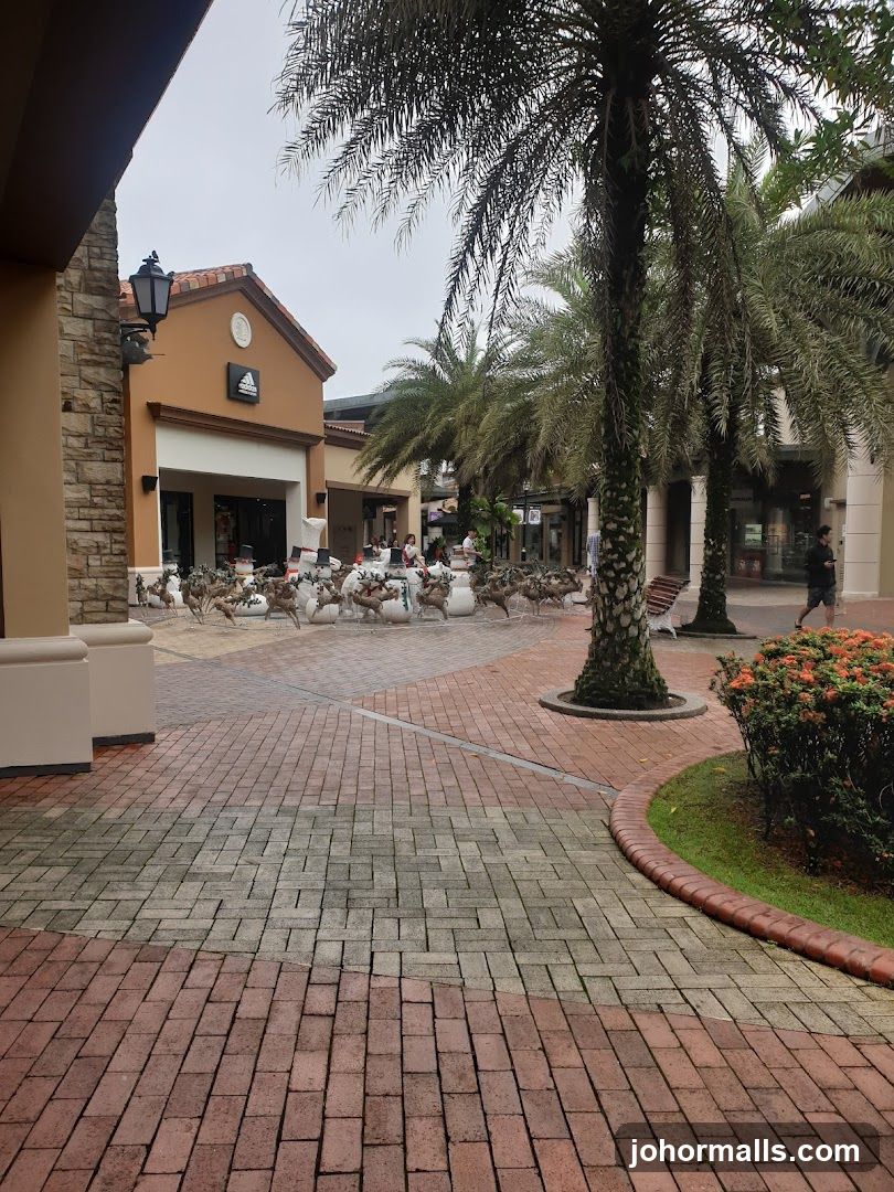 Outdoor shopping area with holiday decorations