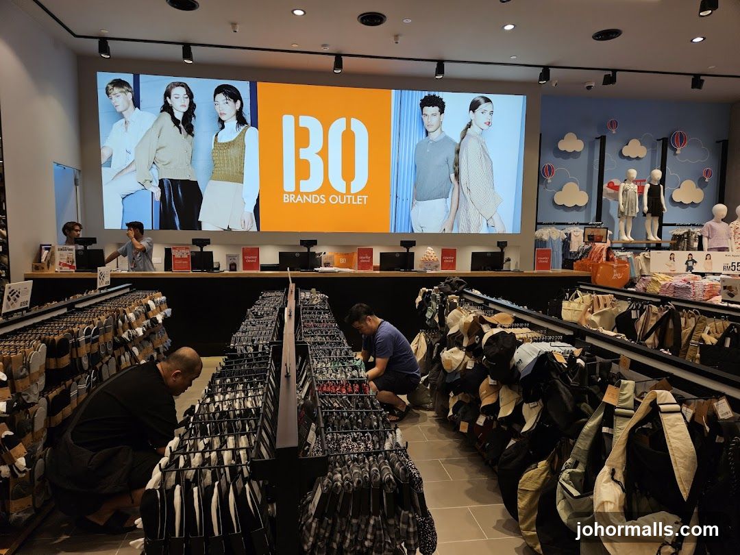 Clothing store interior with large digital display