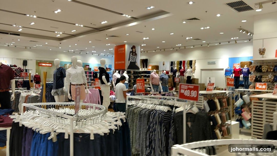 Clothing store interior with mannequins and sale signs