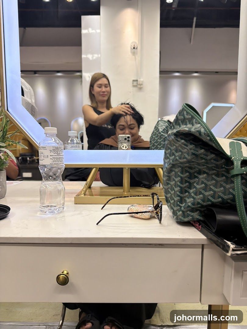 Hairdresser styling client's hair