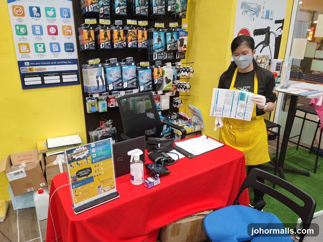 Staff member holding a chart at a display table