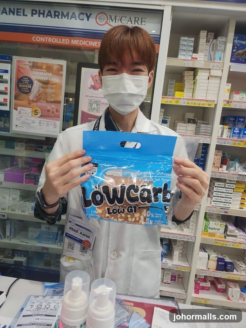 Pharmacist holding a product