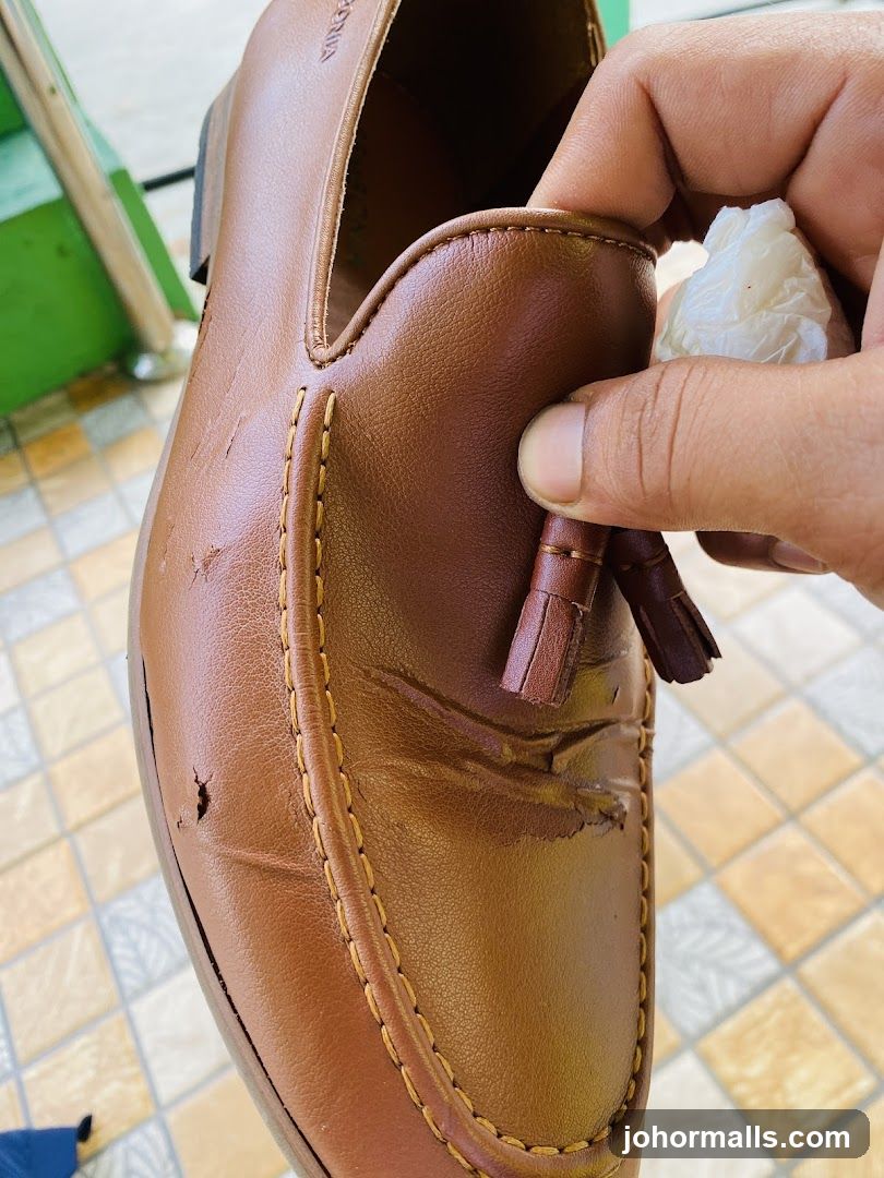 Damaged Brown Leather Loafer