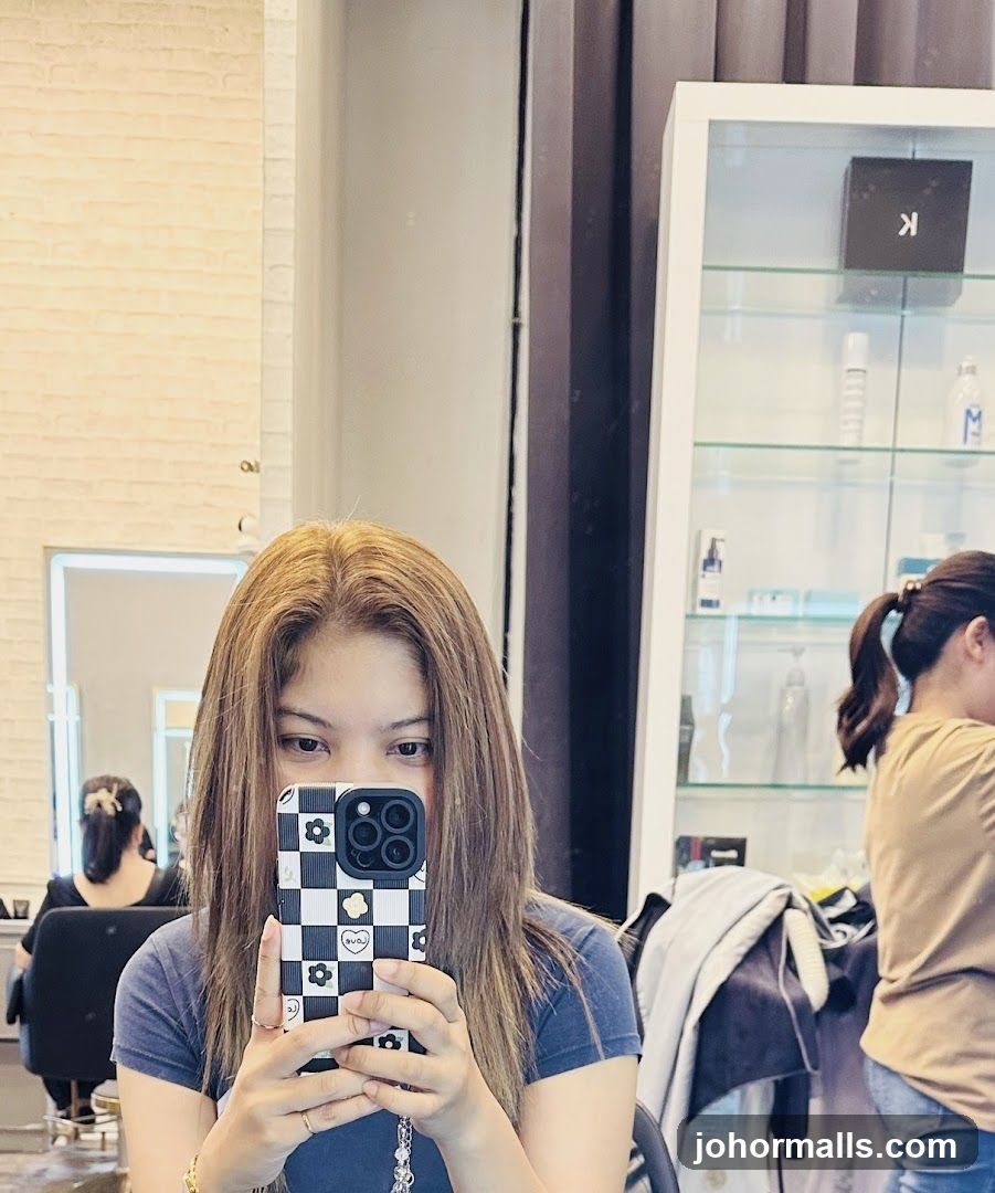 Woman taking a selfie in a salon