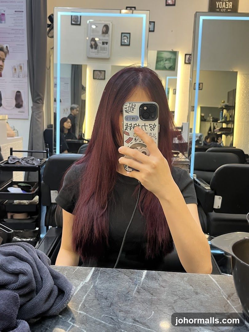 Woman taking a selfie in a salon