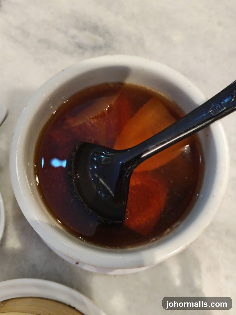 Bowl of Broth with Sliced Ingredients