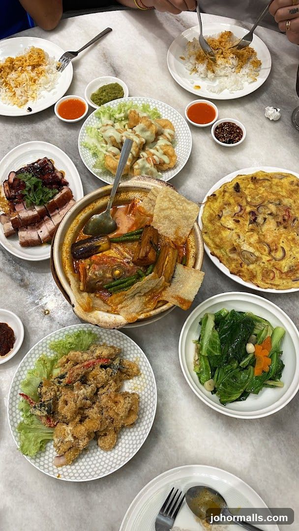 A spread of Asian dishes on a marble table