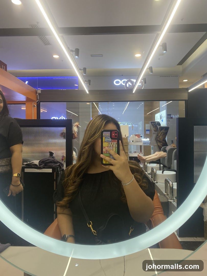 Woman taking a selfie in a salon