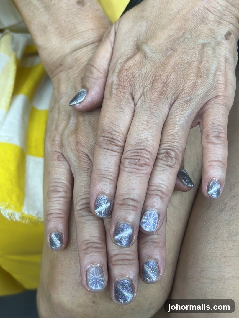 Nails with snowflake and glitter design