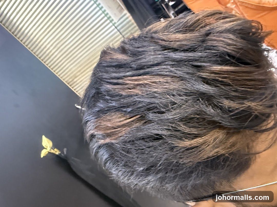 Close-up of man's hair with highlights