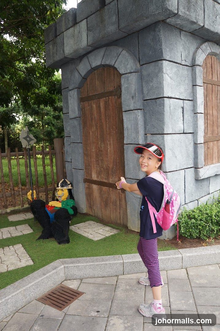 Girl in front of Lego castle entrance