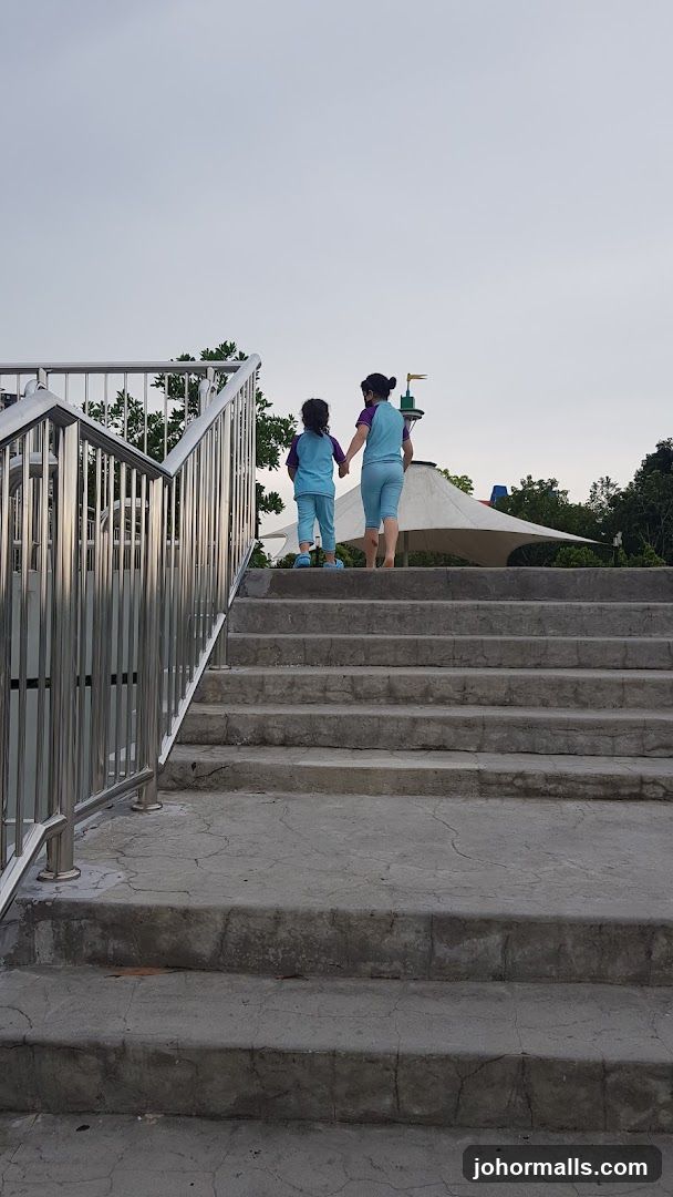 Two people walking up stairs
