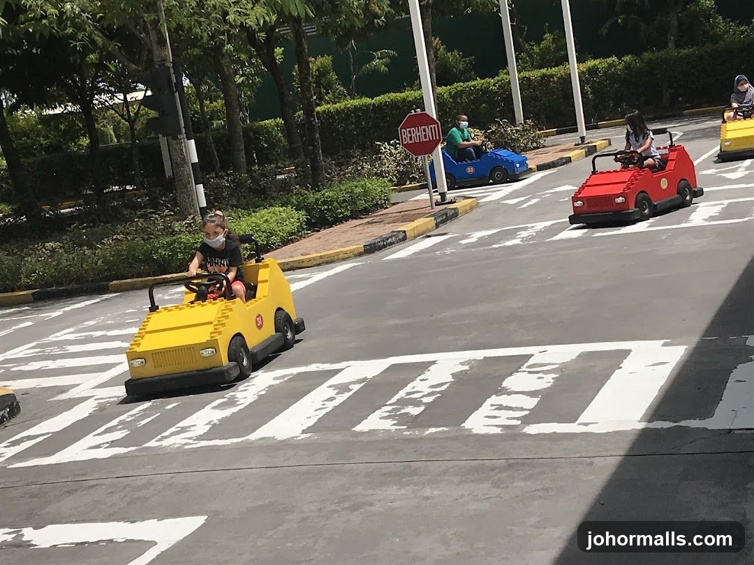 Children driving toy cars