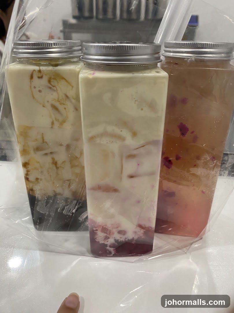 Three drinks in square bottles