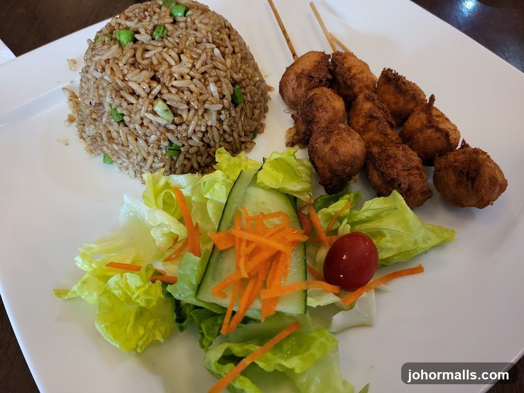 Fried Rice with Skewers and Salad