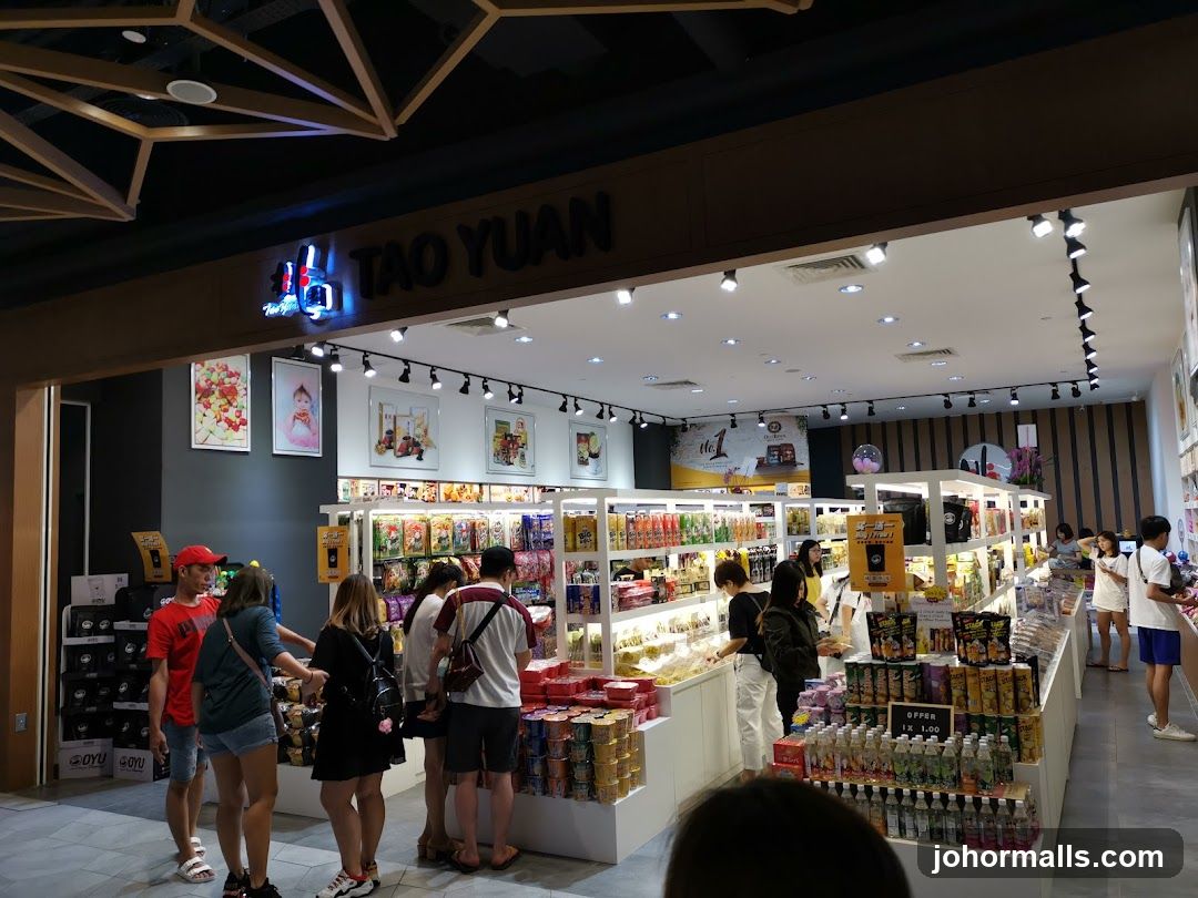 Interior of a store with shelves stocked with snacks and drinks