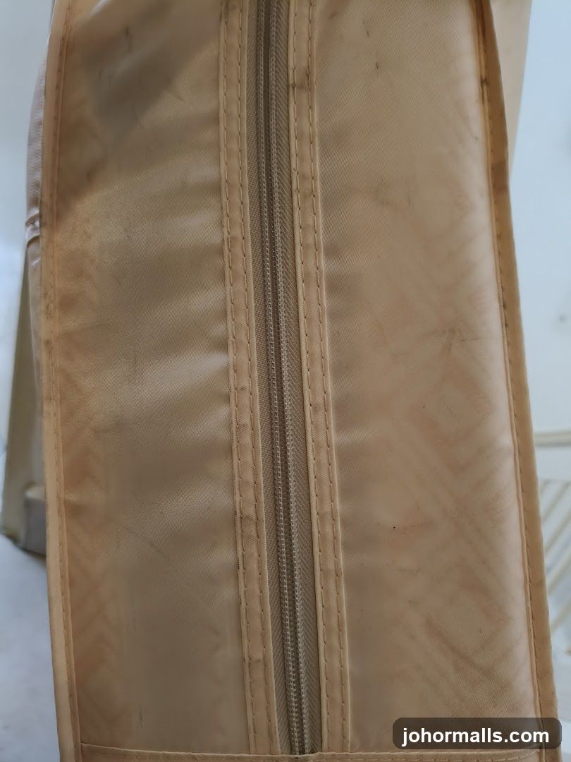 Beige garment bag with zipper