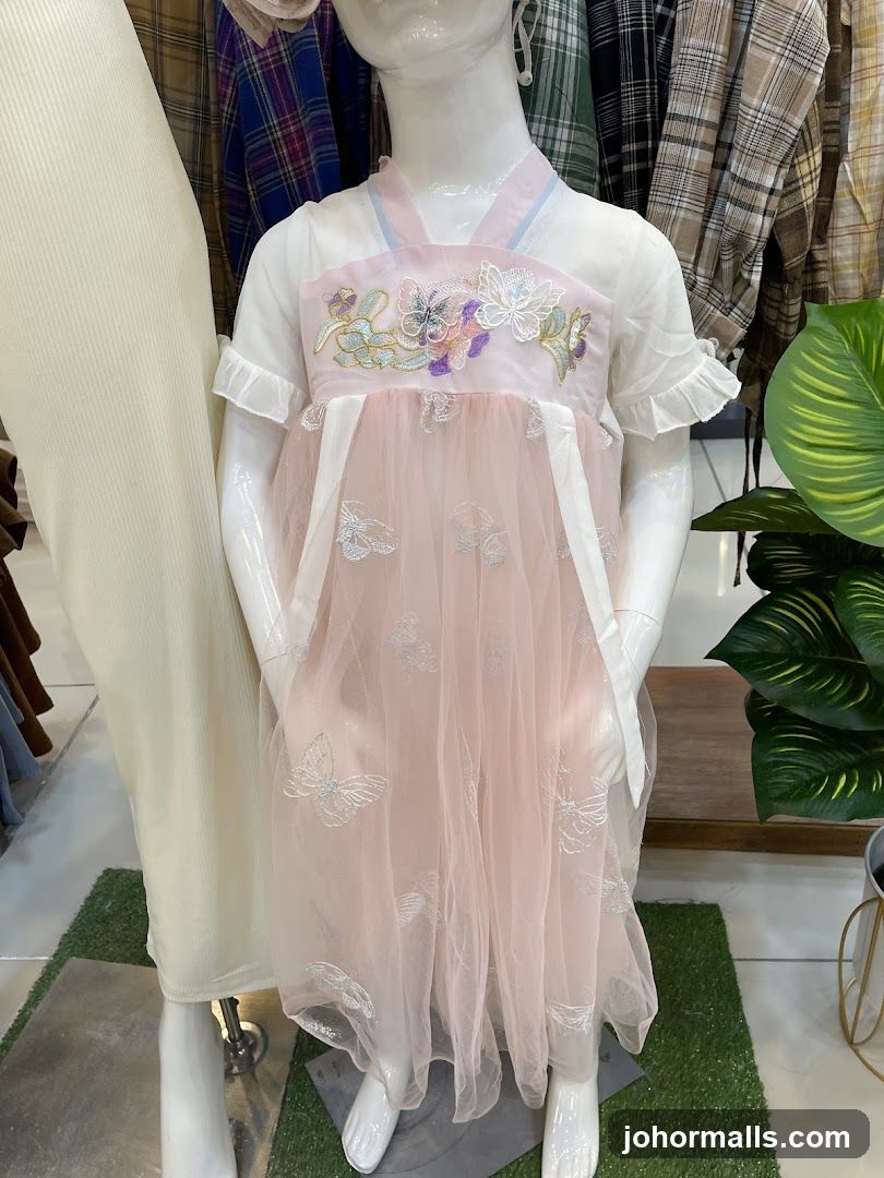 Mannequin wearing a pink dress