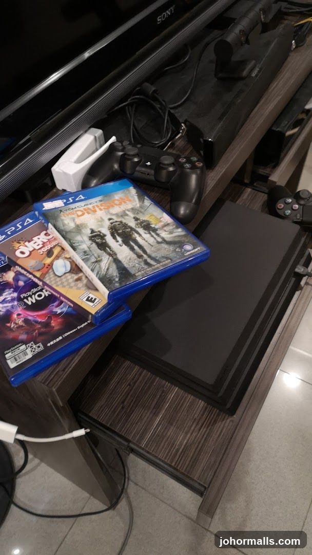 PlayStation 4 console with games and controllers