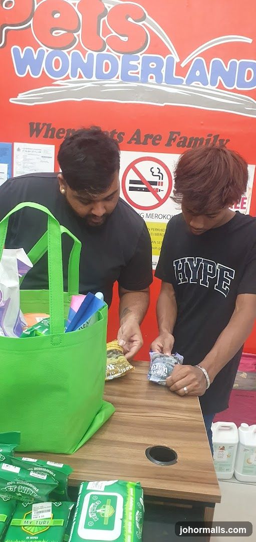 Two men examining pet products