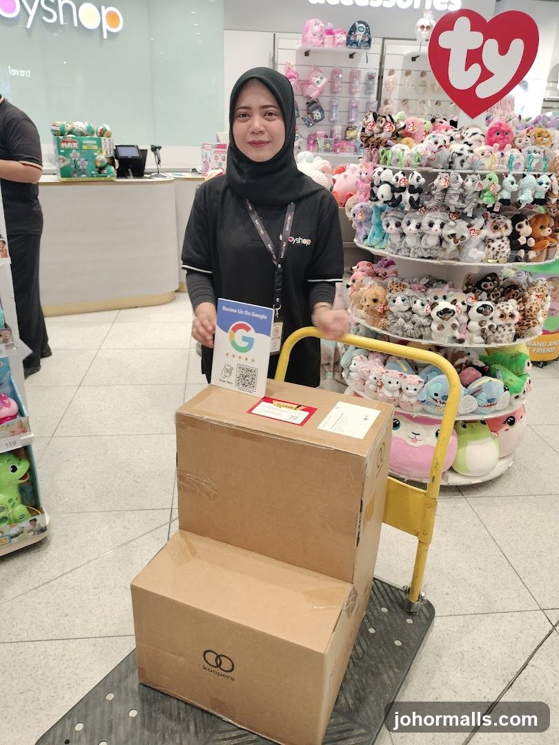 Employee with boxes and review card