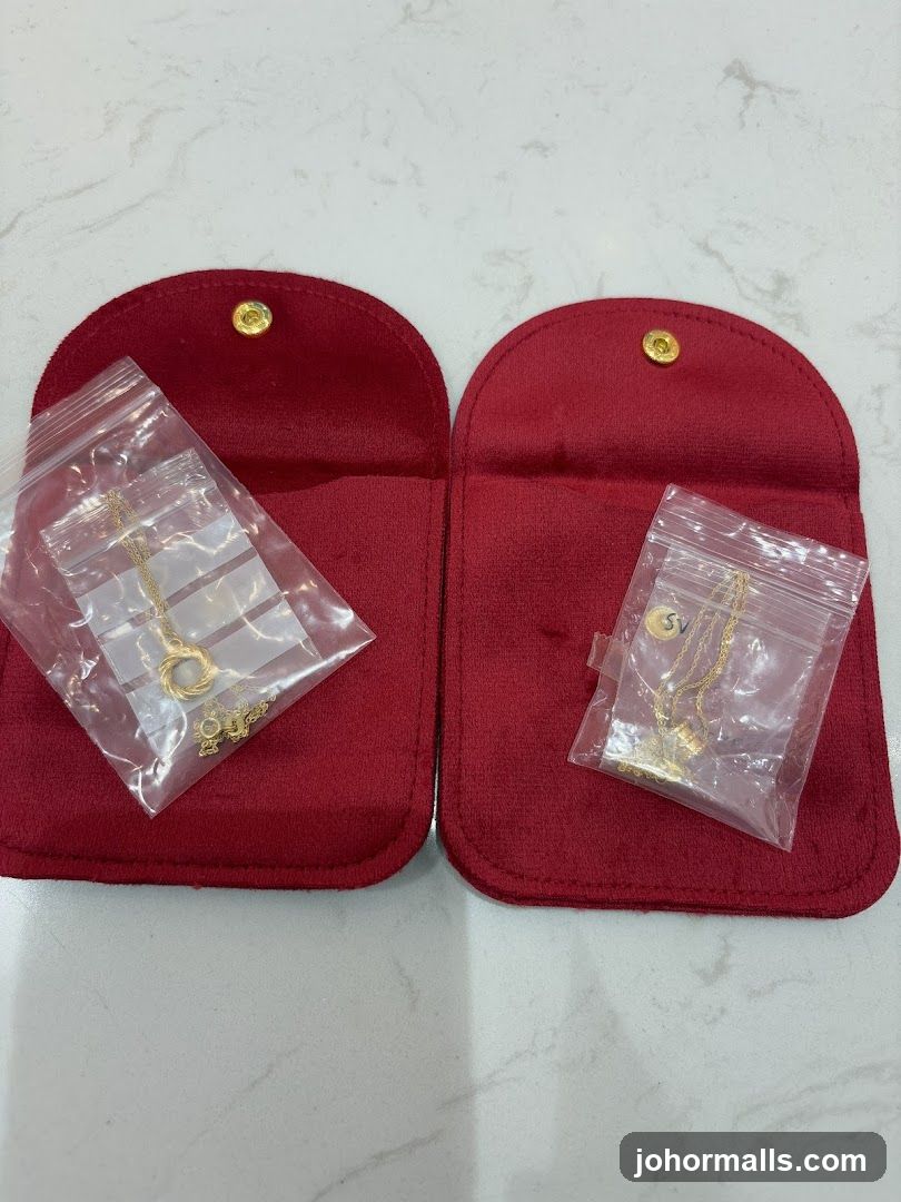 Two Necklaces in Red Pouches