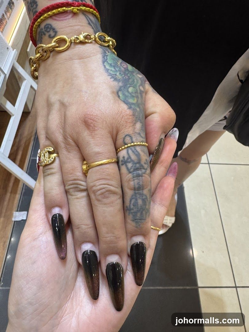 Tattooed Hand with Ombre Nails