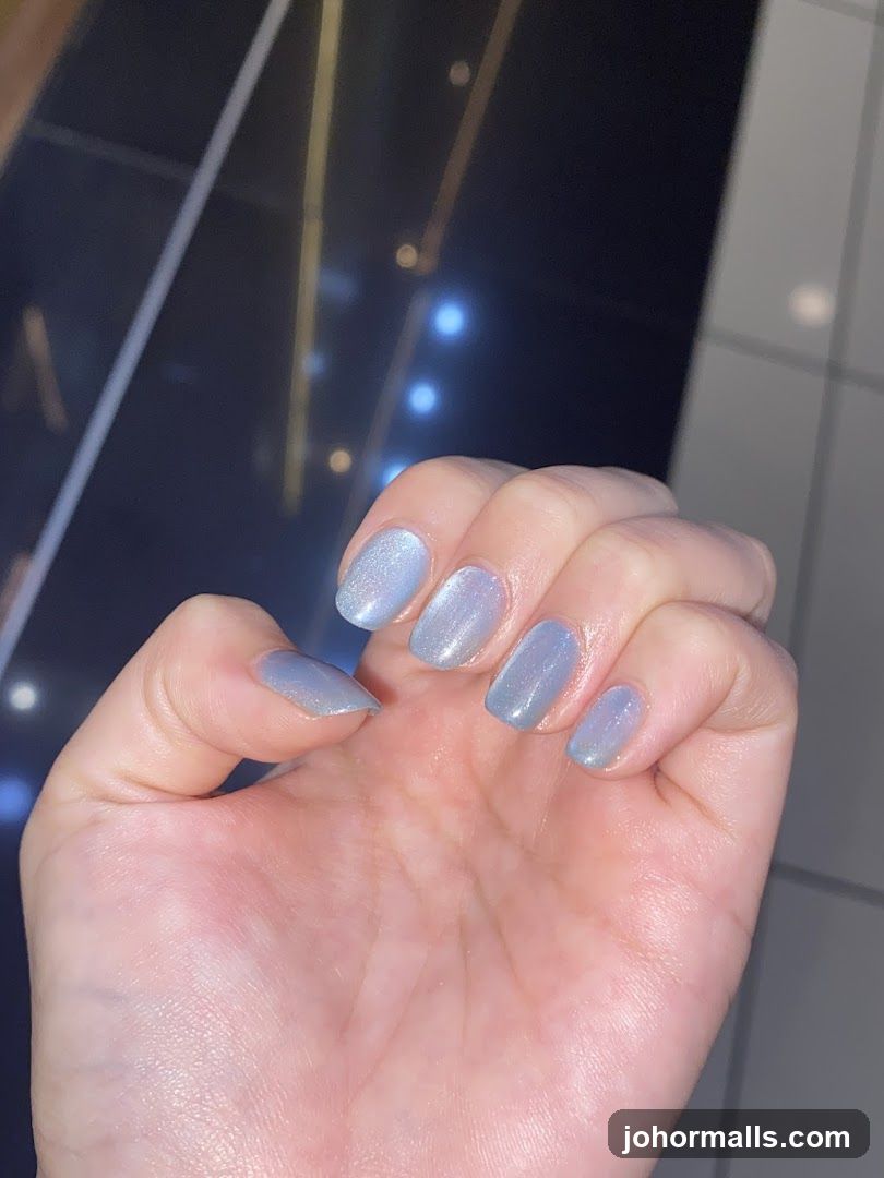 Hand with light blue nails
