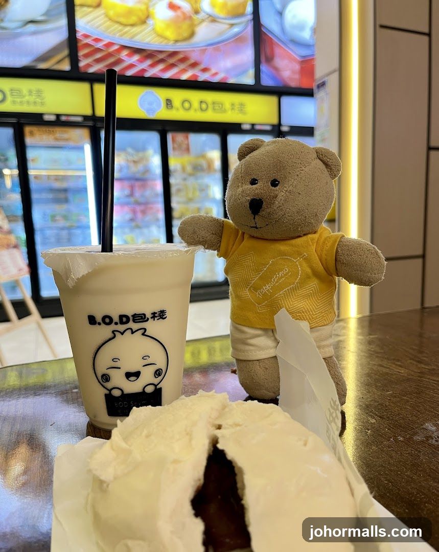 Teddy bear with drink and bun