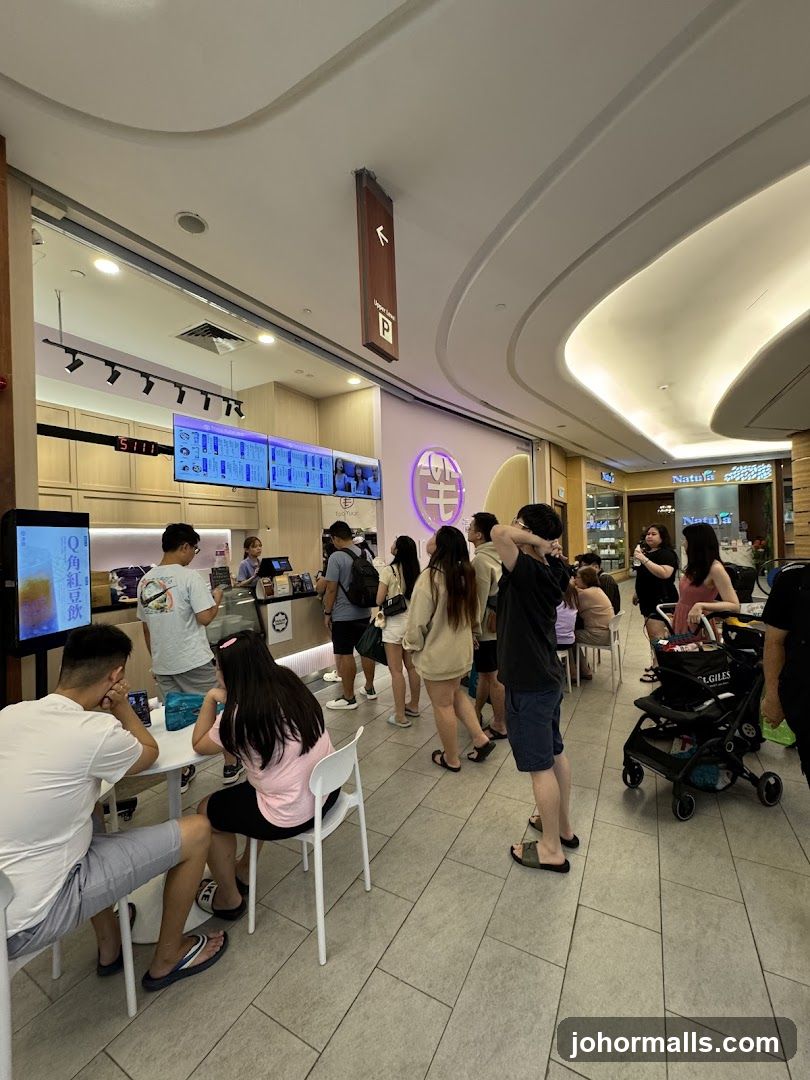 People queuing at a food stall