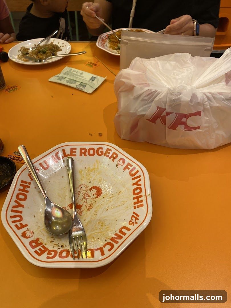 Table with leftover food and KFC bag
