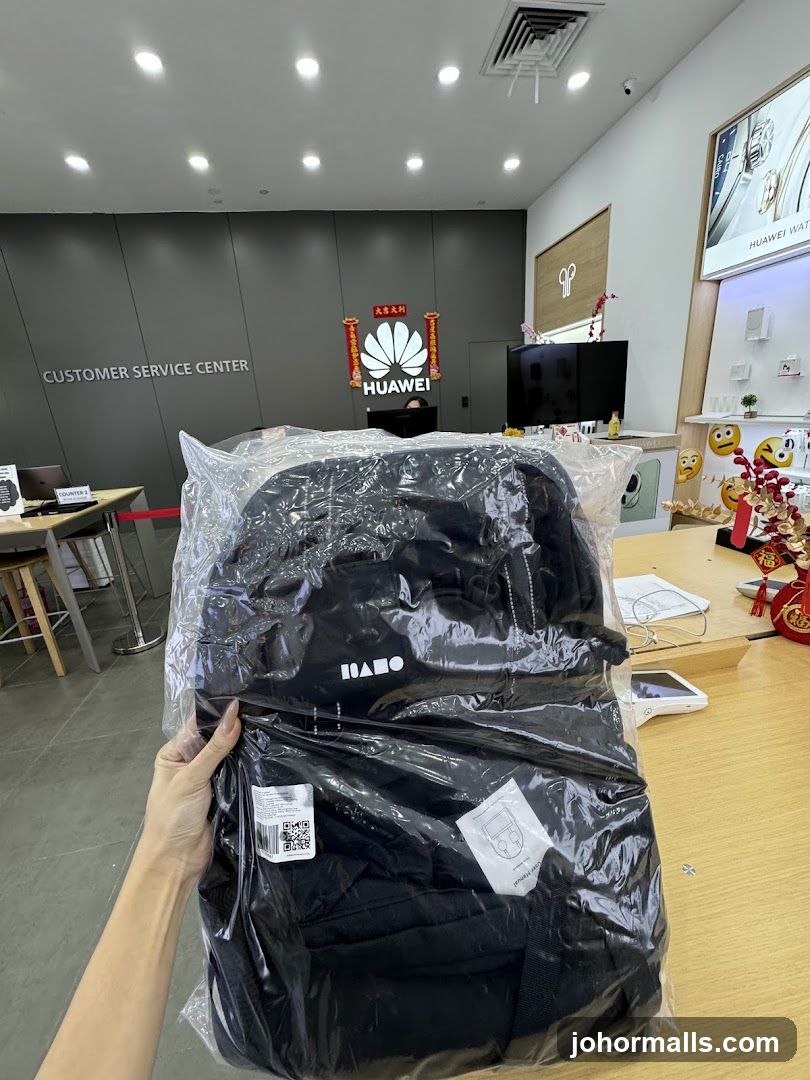 Black Backpack in Plastic Packaging