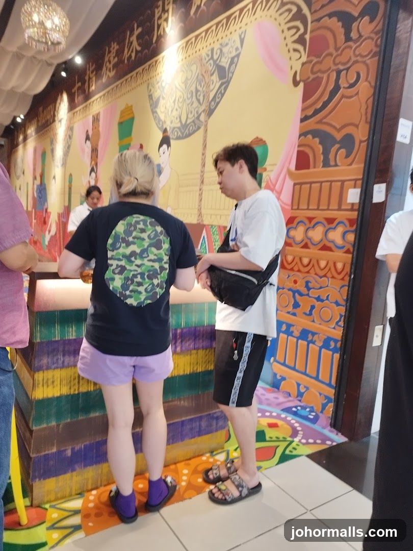 People in a room with a mural