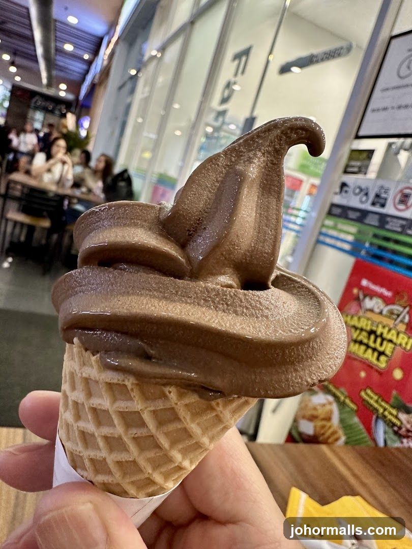 Chocolate soft serve ice cream cone