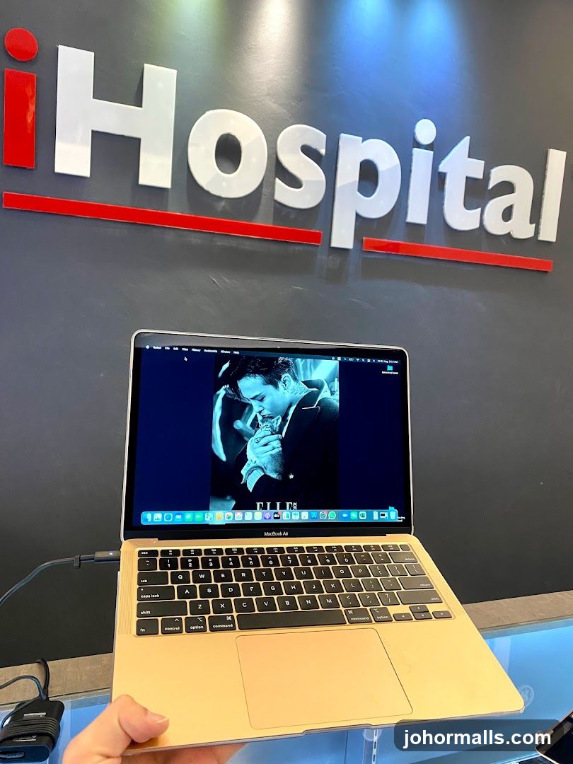 MacBook Air with iHospital Logo