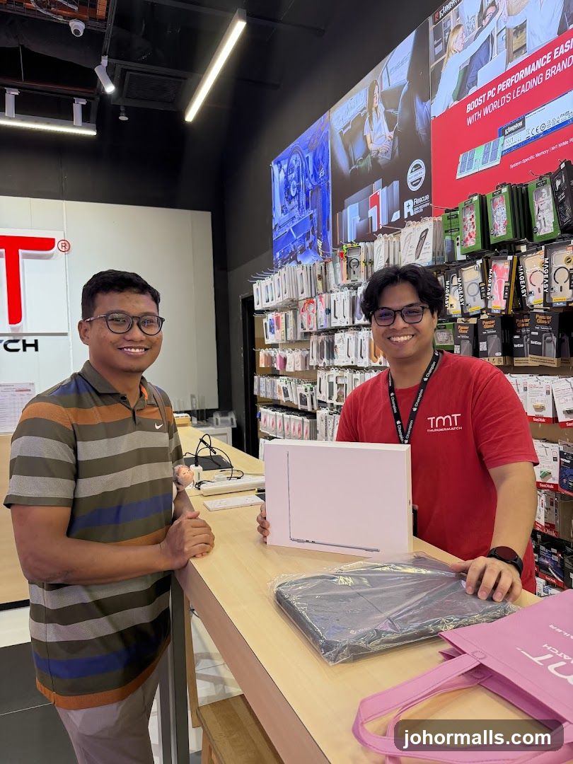 Customer and Staff with Laptop Purchase