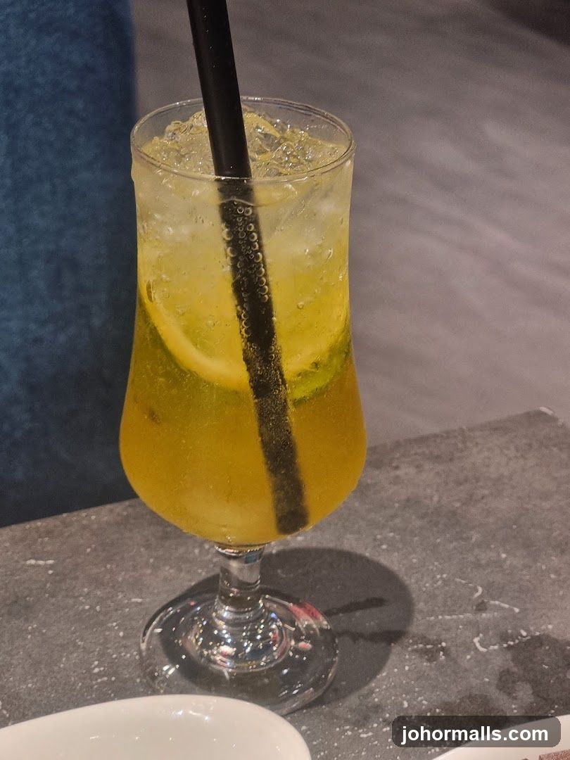 Yellow Drink with Lemon and Ice