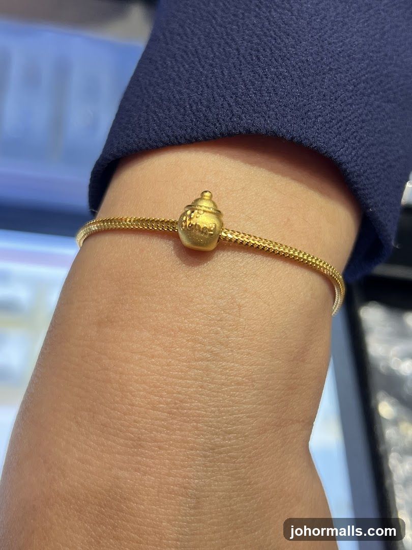 Gold Bracelet with Charm