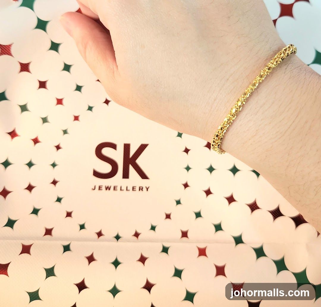Gold Bracelet on Hand with SK Jewellery Branding