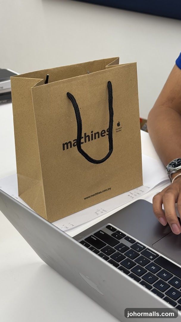 Brown paper shopping bag with "machines" logo