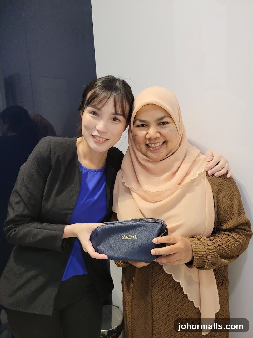 Two women posing with a cosmetic bag