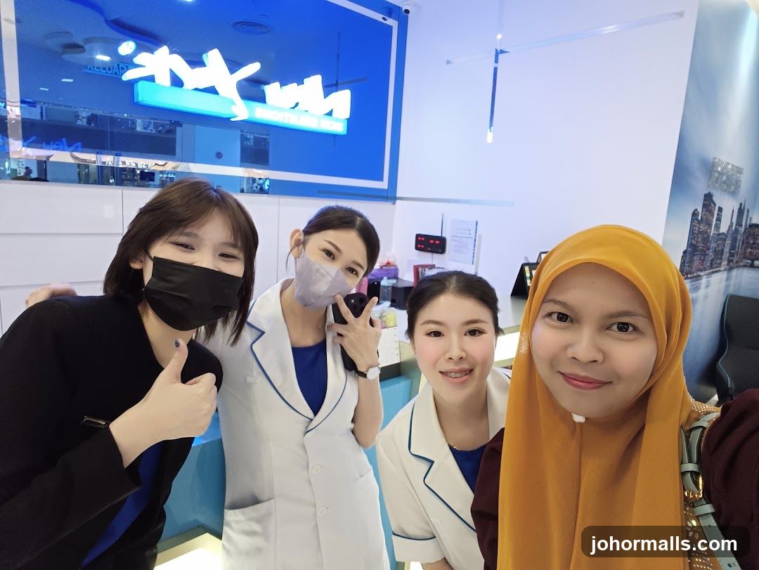 Four people posing for a selfie