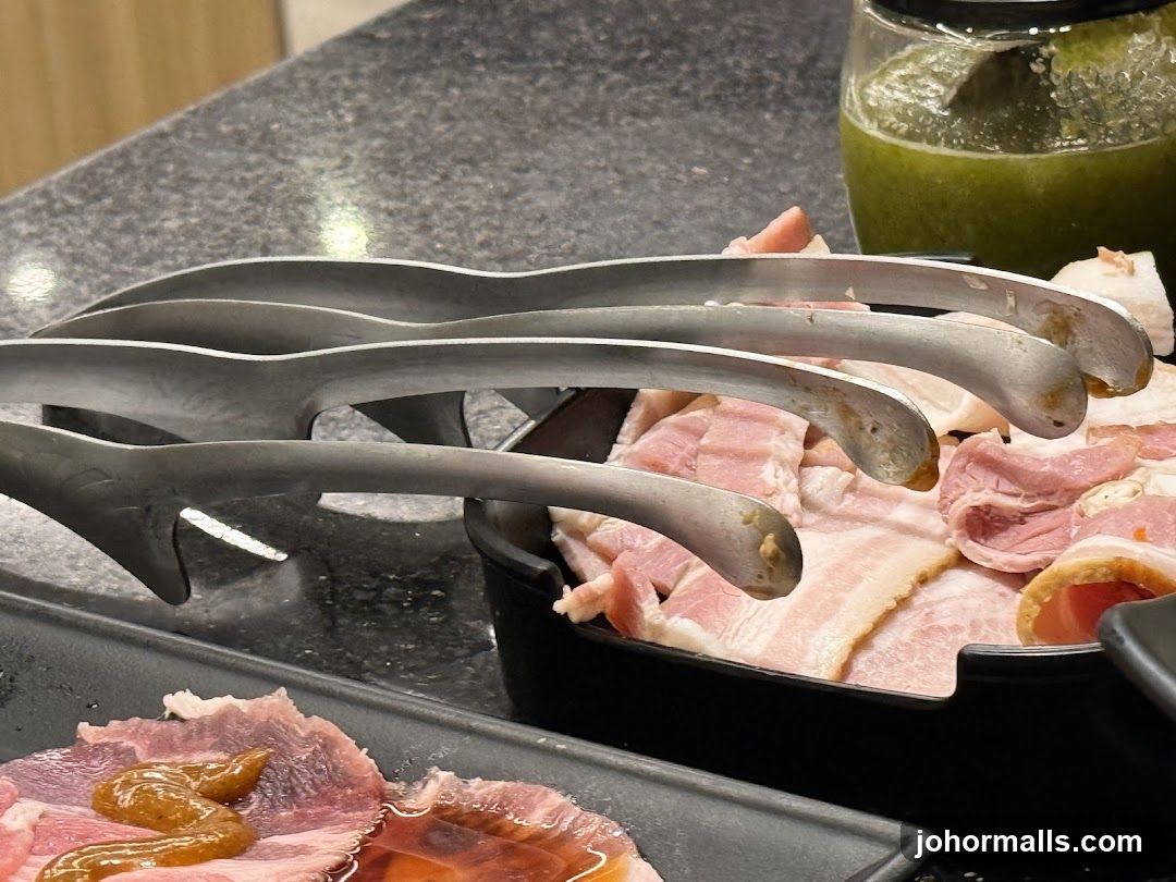 Raw Meat and Tongs