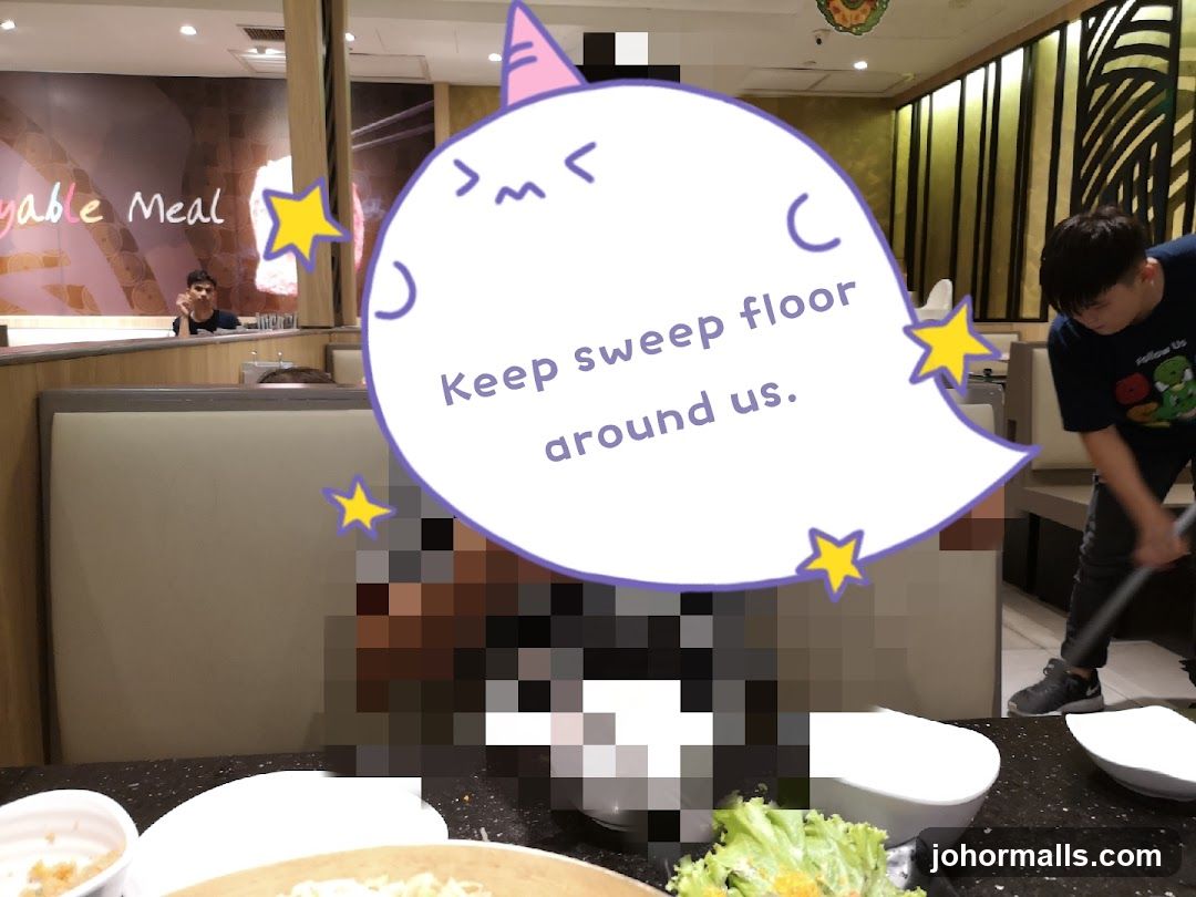 Restaurant Interior with Cleaning Staff