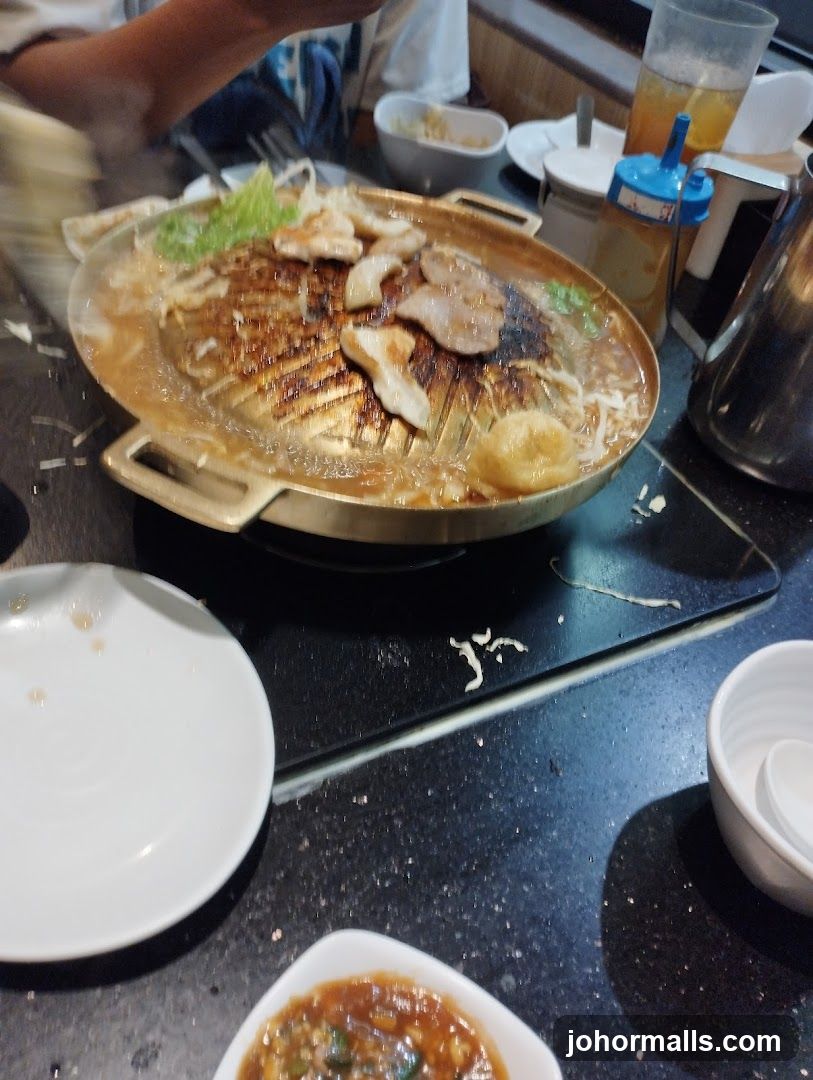 Grilling Meat at a Restaurant
