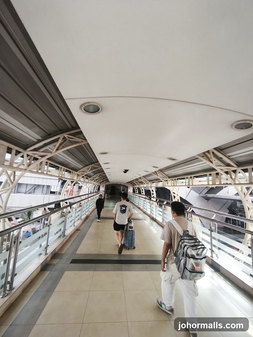 People walking on a covered walkway