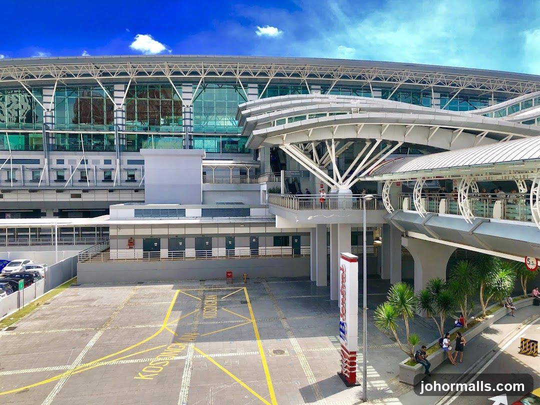 Modern Building with Skywalk and Parking Lot