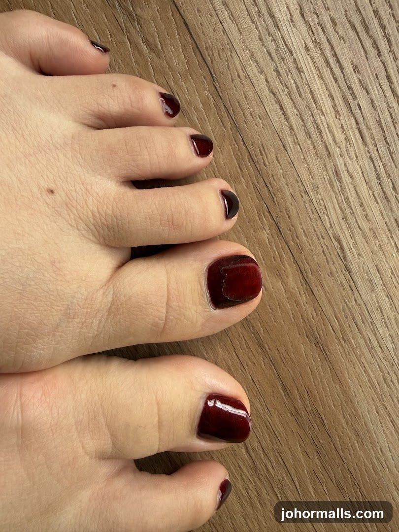 Close-up of Toes with Dark Red Nail Polish