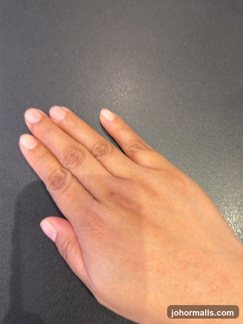 Hand on a dark surface