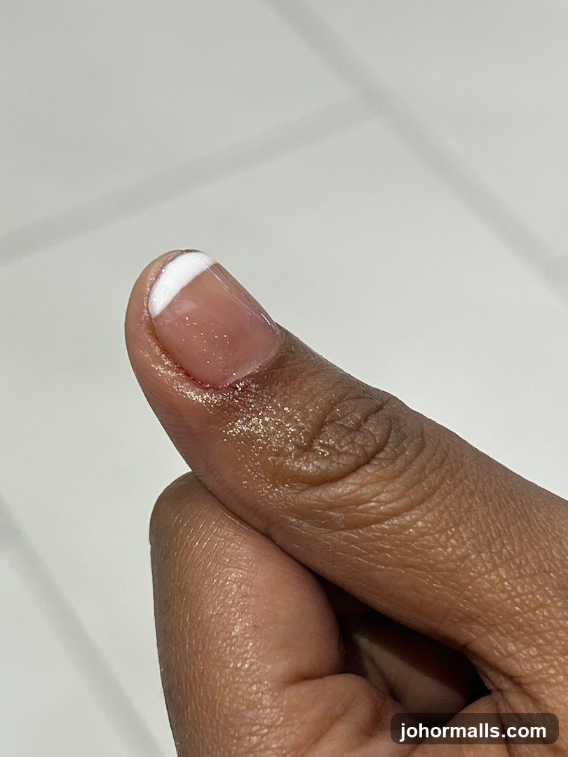 Close-up of a manicured thumb